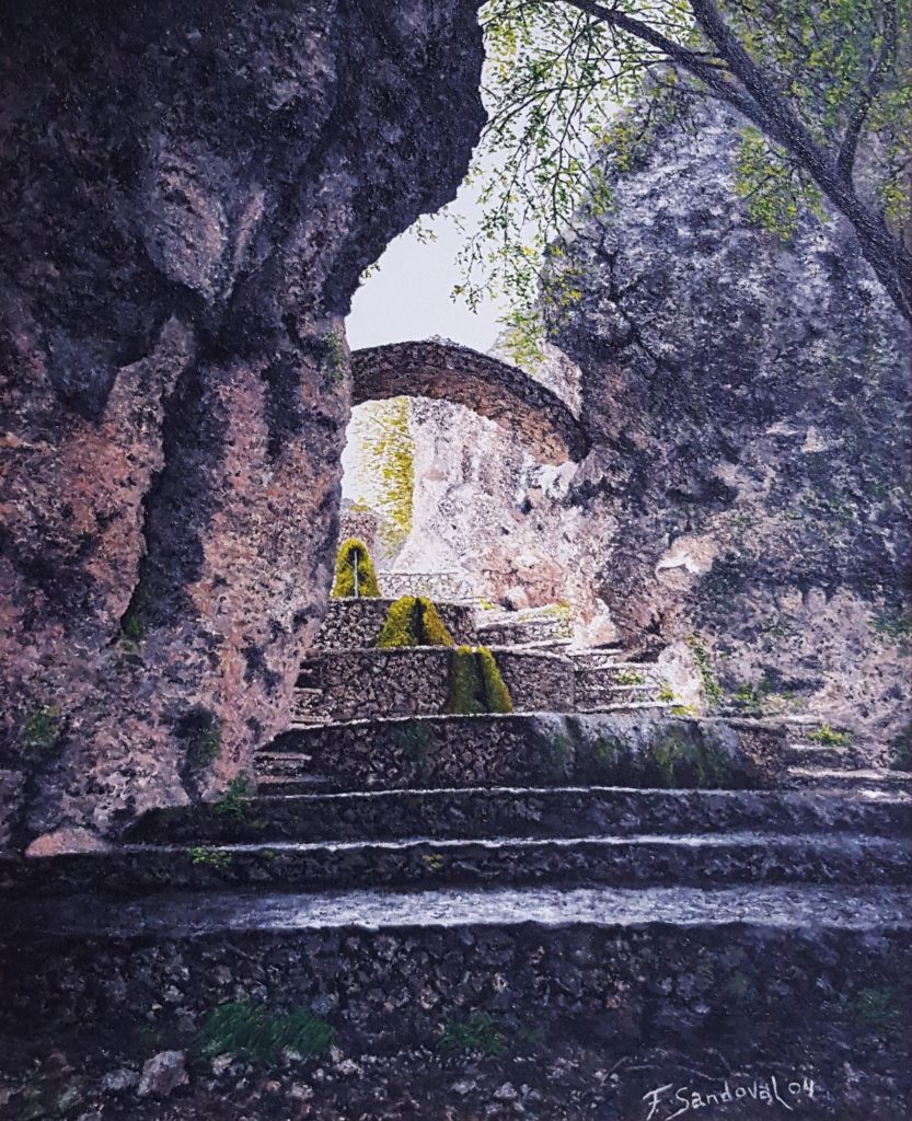 Fuente de Riópar Viejo, en la sierra de Alcaraz, viendo como entra la luz entre las rocas, con el agua saltando por la superficie inferior del lienzo.