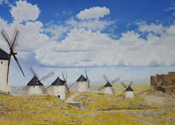 Destaca la belleza y singularidad de estos molinos de consuegra en la mancha, con su imponente castillo medieval y al fondo la llanura manchega.
